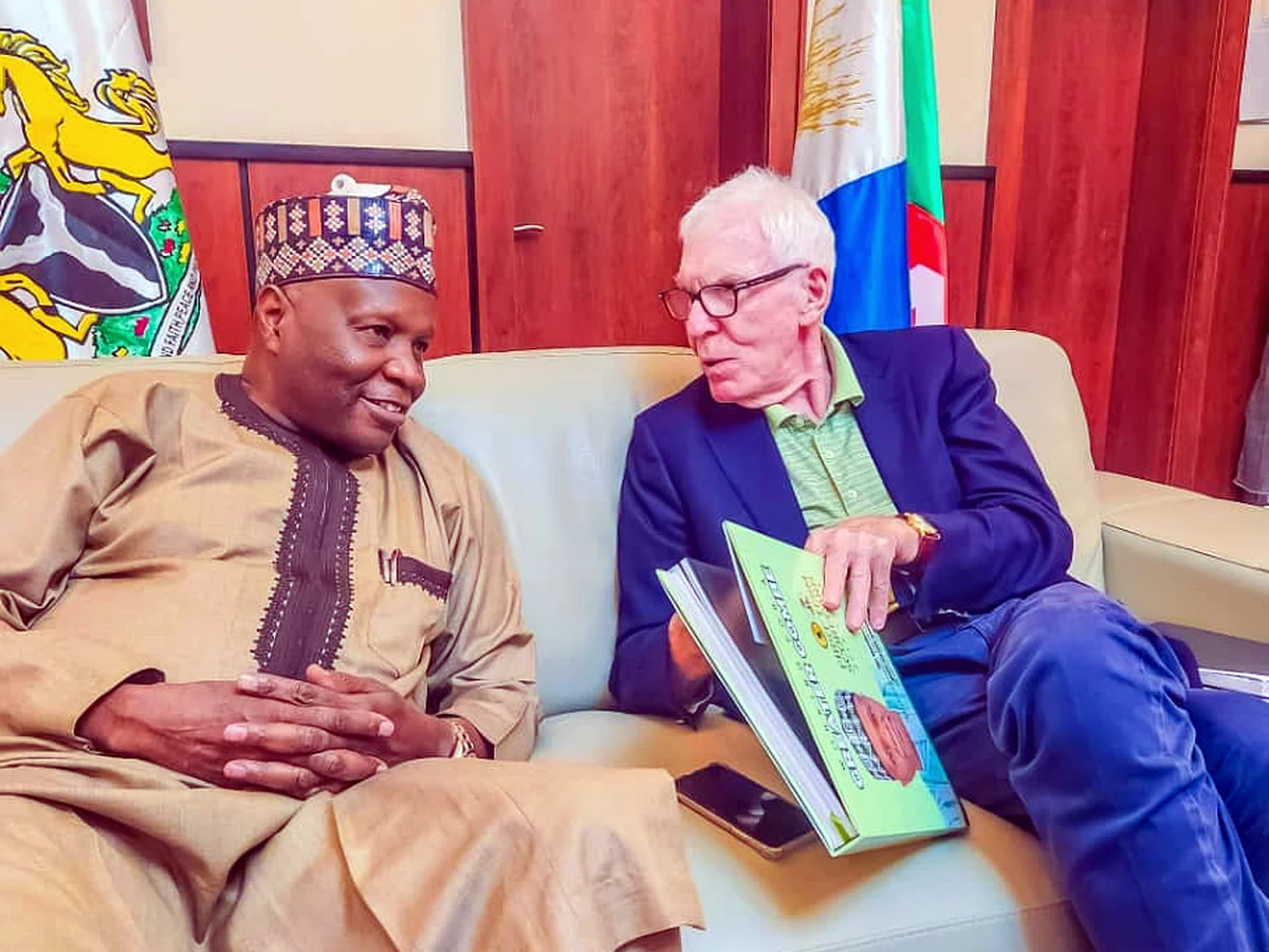 Dr David Winn in discussion with a Nigerian counterpart